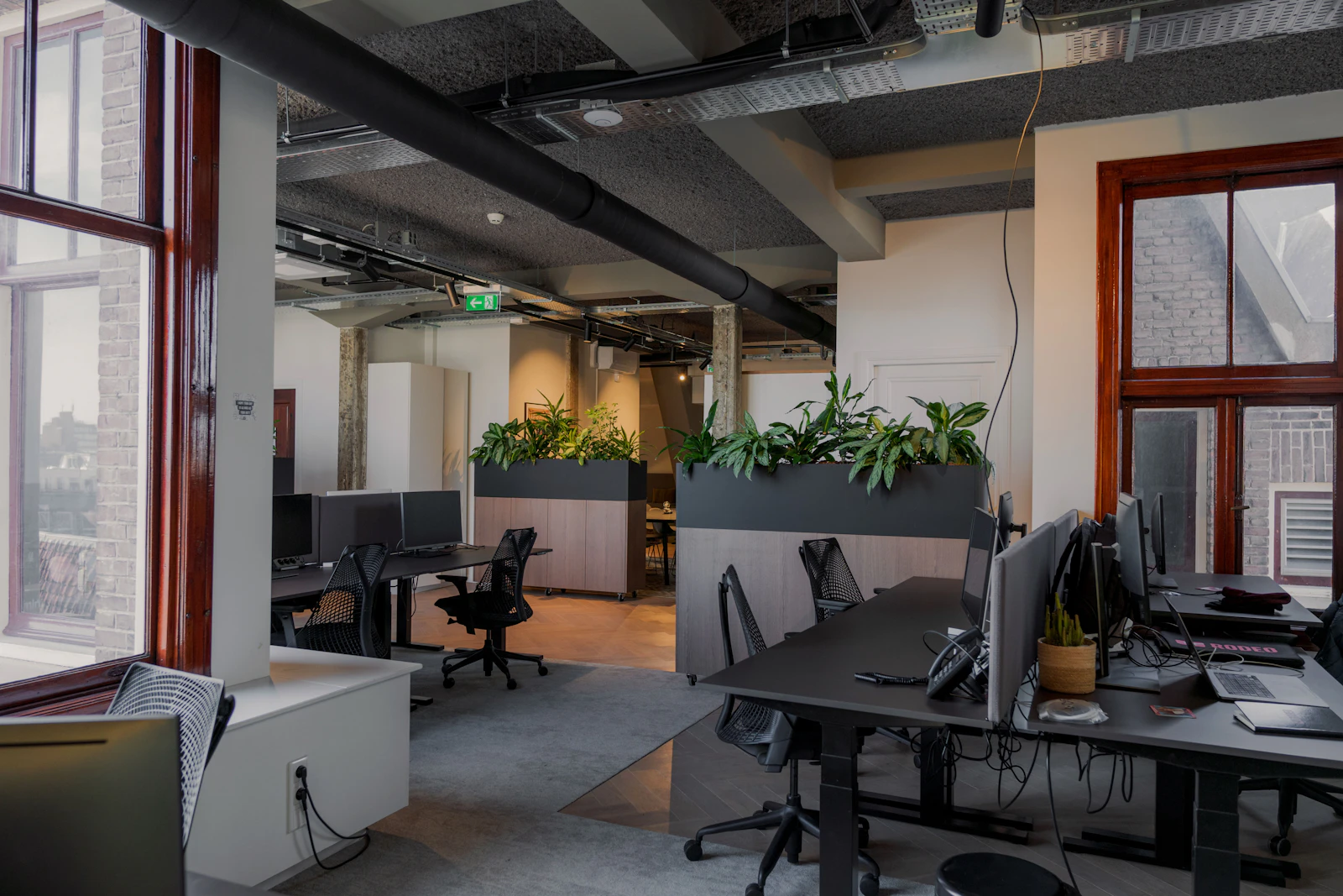 An office with a lot of desks and computers