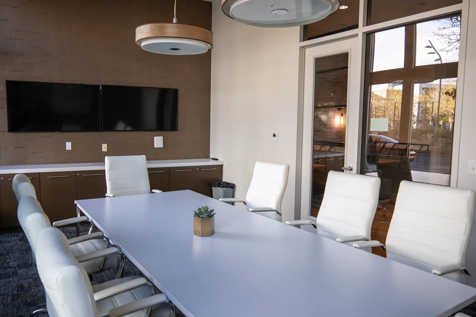 Spacious and modern conference room with sleek furniture and natural lighting
